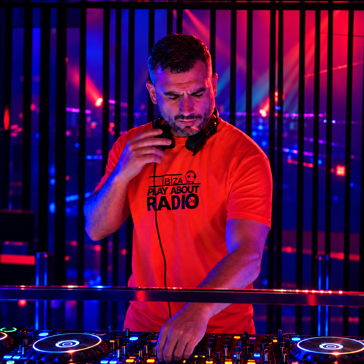 Paul Clee DJ performing behind the decks